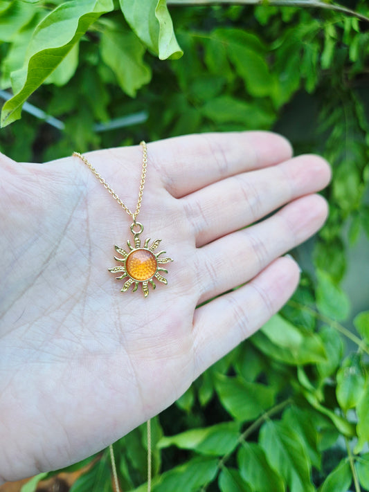 Orange sun charm necklace