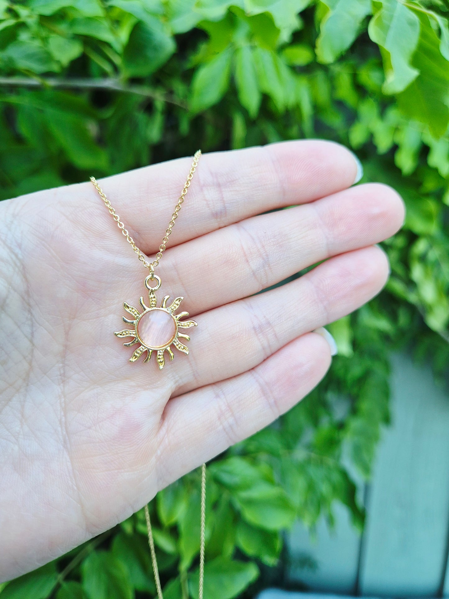 Pink sun charm necklace